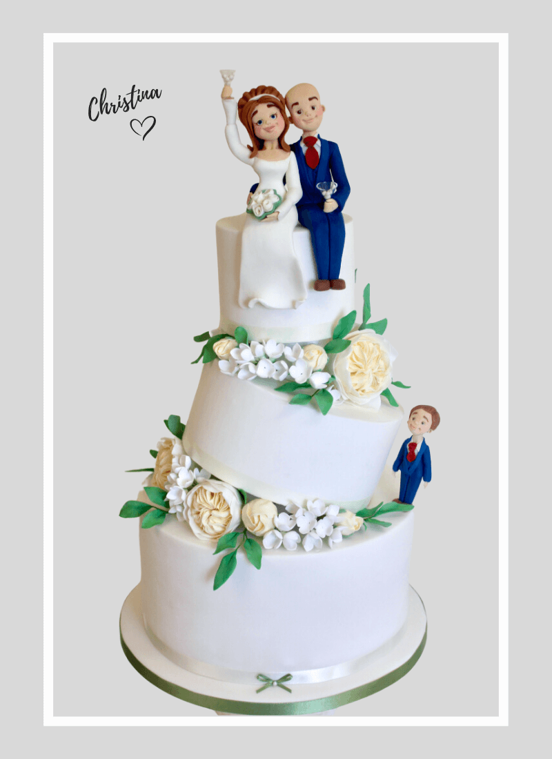 Custom Wedding cake in a fun tilted topsy turvey style topped with personalised clay wedding cake toppers
