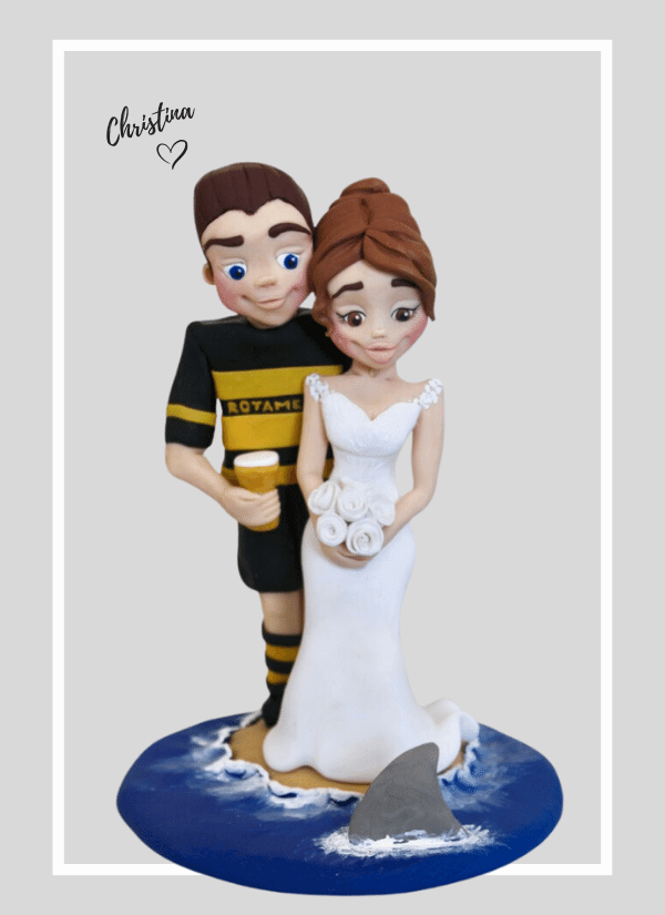 Fun football/rugby themed custom wedding cake topper figurine
