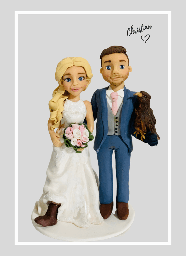 fun customised bride and groom cake topper for wedding cake