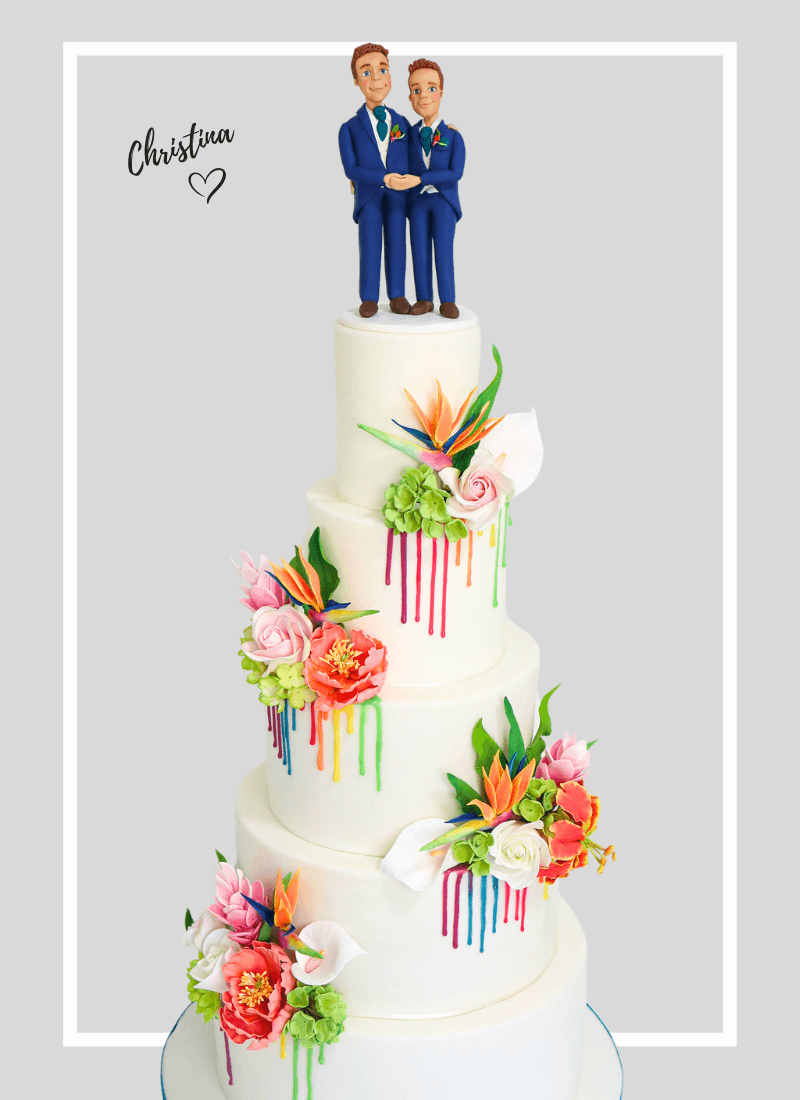 bespoke wedding cake vibrant tropical Wedding cake, topped with gay/same sex wedding cake figures in a suits holding hands