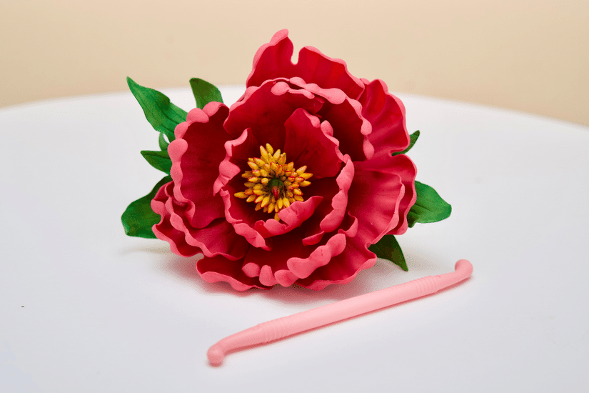 bone tool helps shape petals to create sugar flowers