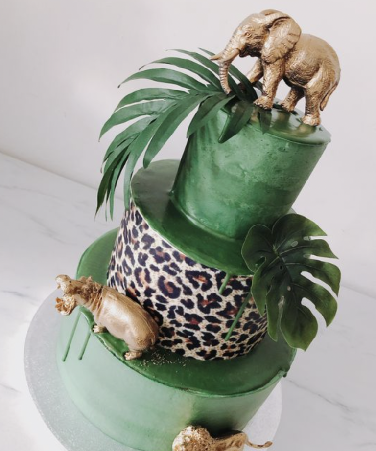 Boho style safari cake with gold animals, green cake and leopard print