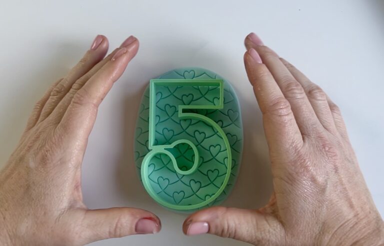 Cutting out the fondant candle with number cutters